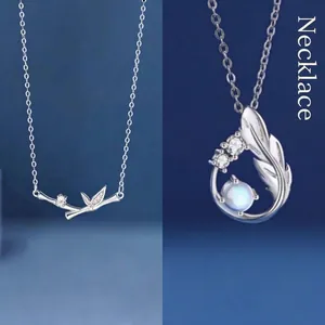 Elegant silver-toned bamboo leaf and wing feather pendant necklaces for women gift set