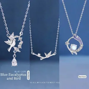 Silver bird and bamboo pendant necklaces with sparkling crystals for women