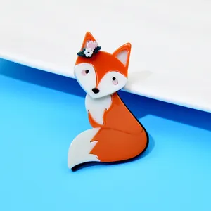 Detailed close-up showing the glossy finish of a cute orange acrylic fox brooch
