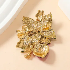 Vintage gold-toned strawberry leaf brooch with safety pin back for coats and suits