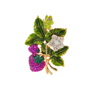 Vintage strawberry brooch with pink rhinestones and green enamel for women's suits.