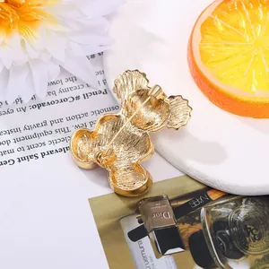 Elegant gold-colored cute bear brooch jewelry accessory with secure safety pin closure