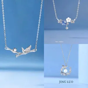 Elegant set of bamboo, flower, and whale tail pendant necklaces with sparkling crystals