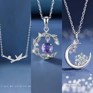 Elegant bamboo moon and snowflake pendant necklaces in silver finish