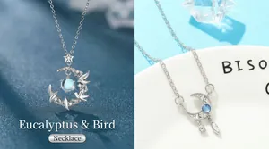 Elegant silver-toned moon and bird pendant necklace with a blue gemstone SKU variant