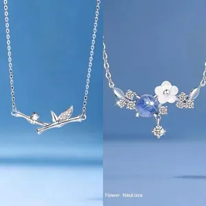 Elegant silver-toned bamboo node and blue stone flower necklace set for women's fashion.