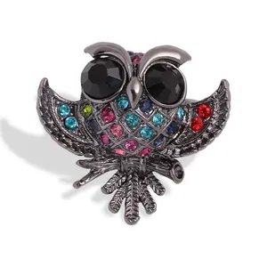 Vintage uilenbroche met kleurrijke strass-steentjes en zwart gefacetteerde ogen voor dames