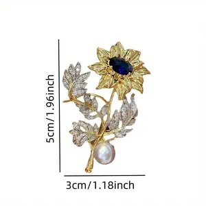Vintage gold sunflower brooch featuring blue sapphire center and pearl, size 5x3cm