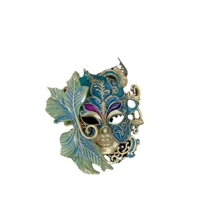 Broche masque vénitien vintage avec feuille verte et détails en émail bleu doré