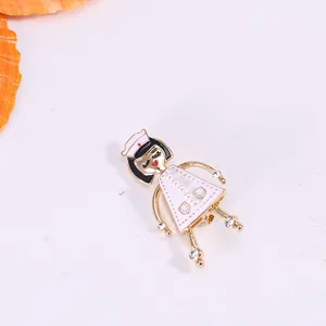 Cute cartoon nurse brooch with white enamel, faux pearls, and rhinestone accents