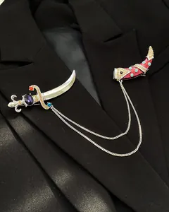 Detailed view of a vintage palace-style curved dagger brooch set pinned on a black blazer.
