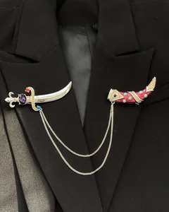 Vintage palace style dagger and scabbard brooch pinned on a black blazer lapel