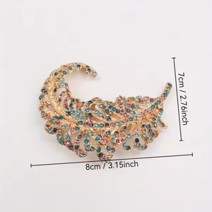 Elegant golden feather brooch with colorful rhinestones and intricate hollow design 8x7cm