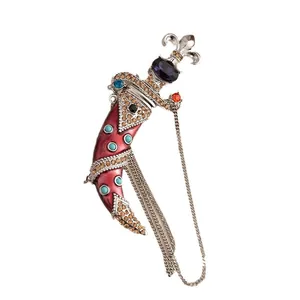Vintage court style curved dagger brooch with red enamel crystals and hanging chains