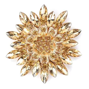 Exquisite champagne crystal snowflake brooch with elegant golden finish plating detail