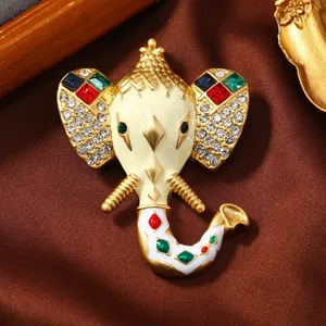 Macro view of a vintage elephant head enamel brooch with colorful sparkling rhinestones