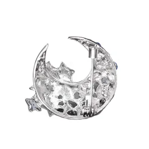Élégante broche lune et étoile en argent avec strass bleus pour revers de costume