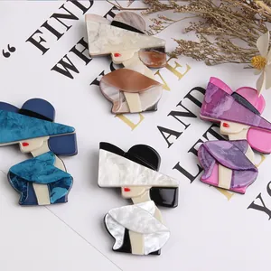 Group of acrylic modern lady brooches with hats in various elegant color patterns.