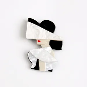 Modern acrylic brooch featuring a chic woman in a hat with elegant pearlescent finish