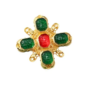 Vintage gold cross brooch pin with red and green enamel stones in ornate royal style