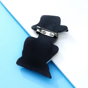 Detailed macro view showing the back pin mechanism of the acrylic girl silhouette brooch