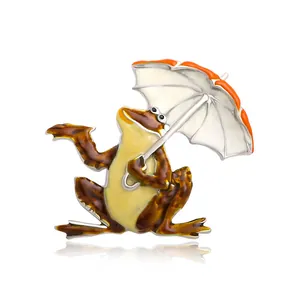 Creative frog holding umbrella brooch with colorful enamel finish on white background