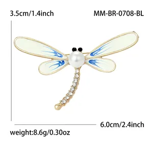 Elegant dragonfly brooch pin featuring white enamel wings pearl and sparkling rhinestones
