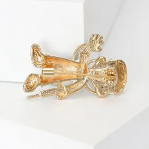 Detailed macro view of the back of a cartoon doctor angel brooch showing the pin clasp