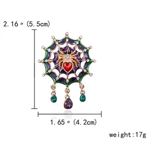 Spider web brooch with rhinestone heart, 5.5cm x 4.2cm dimensions and 17g weight details.