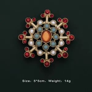 Exquisite vintage Baroque gold brooch featuring red crystals and white pearls details