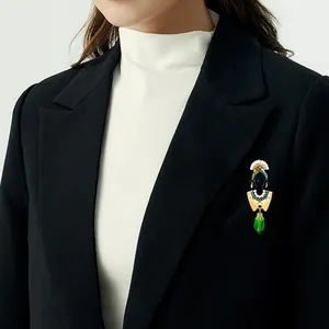 Vintage ethnic style African head brooch with colorful beads and green droplet pendant