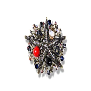 Detailed macro view of vintage starfish brooch featuring colorful rhinestones and gems