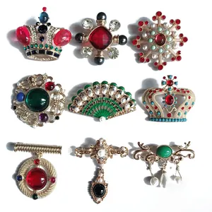 Luxurious Baroque vintage brooch set featuring crown and snowflake enamel designs