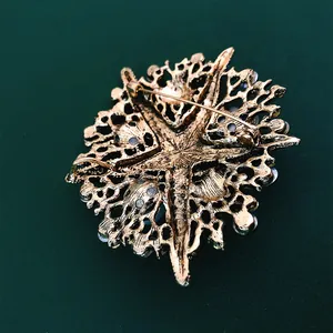 Vintage oversized rhinestone starfish brooch with antique gold finish back view