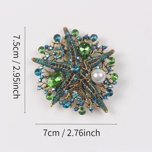Vintage oversized starfish brooch with green and blue rhinestones and pearl detail