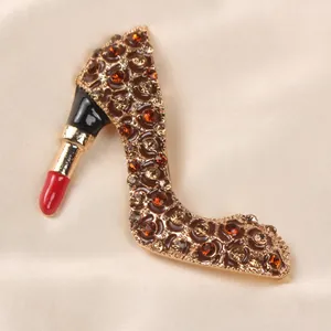 Detailed view of a vintage enamel high heel lipstick brooch decorated with rhinestones