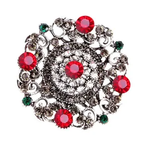 Exquisite vintage Baroque palace style brooch with vibrant red and green gemstones