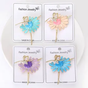 Detail view of colorful ballerina enamel brooches with sparkling rhinestone accents