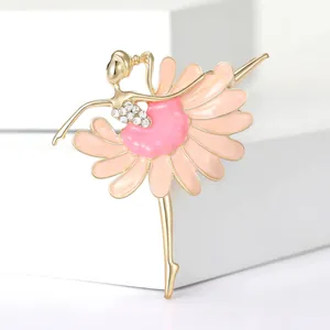 Detailed view of an elegant ballerina brooch with pink enamel and sparkling rhinestones