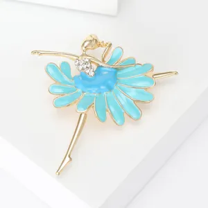 Close-up of elegant ballerina brooch with blue floral enamel dress and crystals