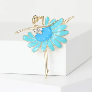 Detailed view of an elegant ballerina brooch with blue enamel petal skirt