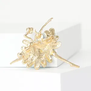 Detailed back view of a gold-plated ballet dancer brooch with a secure pin clasp