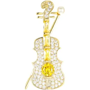 Elegant gold-toned violin brooch adorned with sparkling yellow and white crystals for women