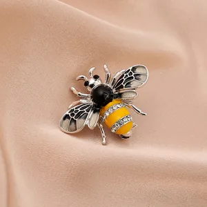 Elegant silver and yellow bee brooch with sparkling crystal rhinestone embellishments