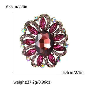 Detail view of vintage flower brooch with red crystals including size and weight specs