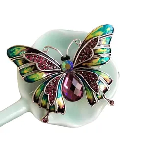 Elegante vintage vlinder emaille broche met paars kristal en kleurrijke vleugels