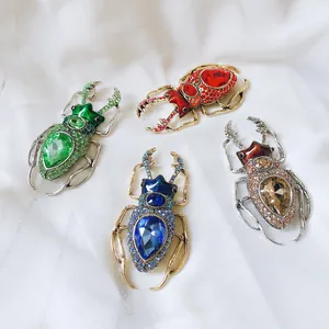 Vintage insect rhinestone brooches set featuring colorful crystal beetle designs for women