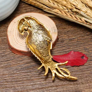 Back view of vintage gold parrot brooch showing metal texture and pin attachment