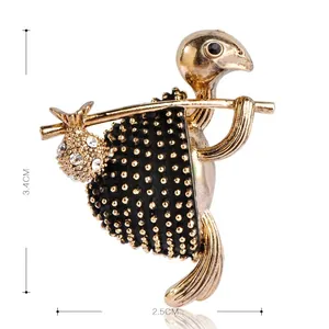 Detailed view of a vintage gold turtle brooch with rhinestones measuring 3.4cm by 2.5cm