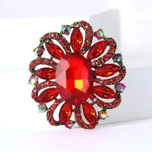 Macro view of vintage style red crystal flower brooch with luxury rhinestone detailing